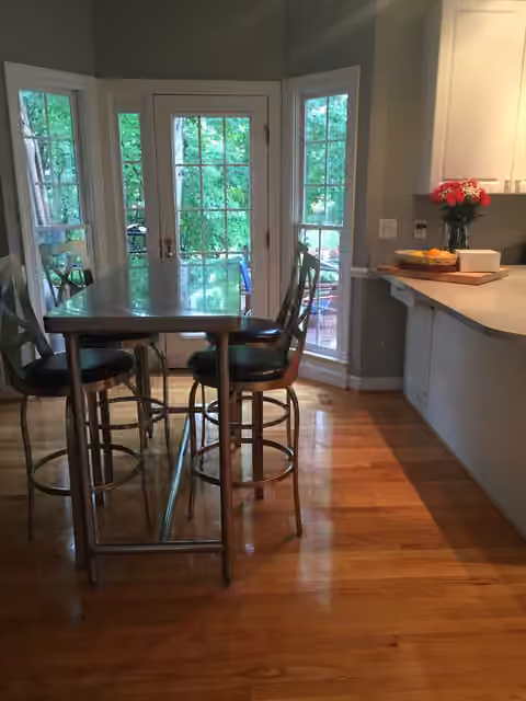 Clean breakfast nook and hardwood floors after home cleaning