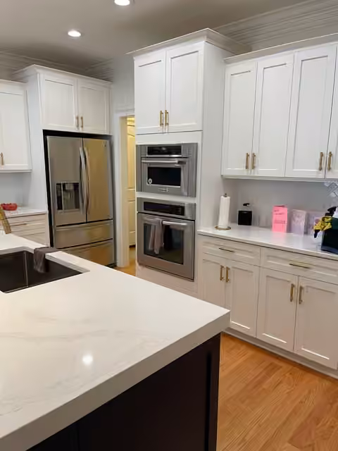 Clean white kitchen with quartz countertops